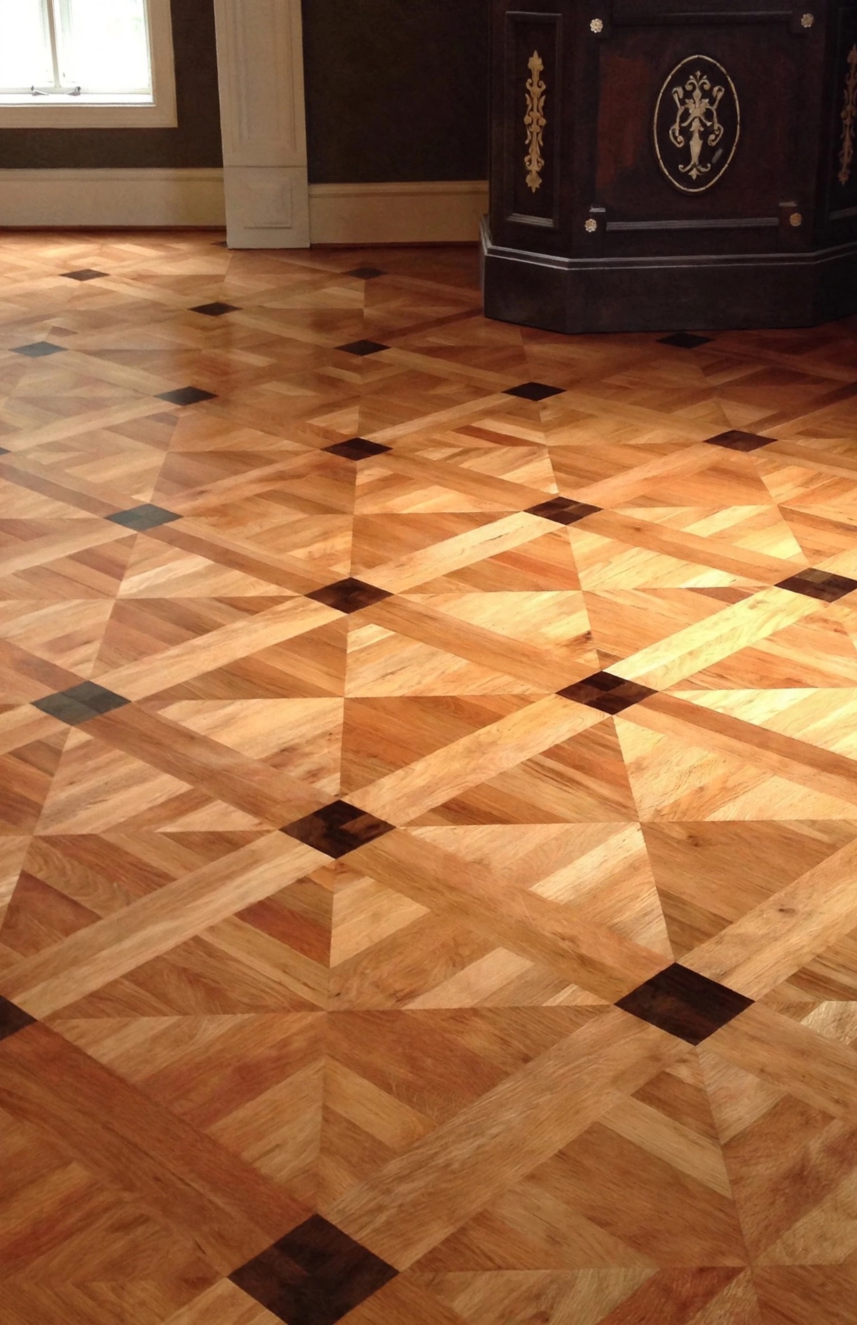 Patterned parquet hardwood floor with dark inlay squares