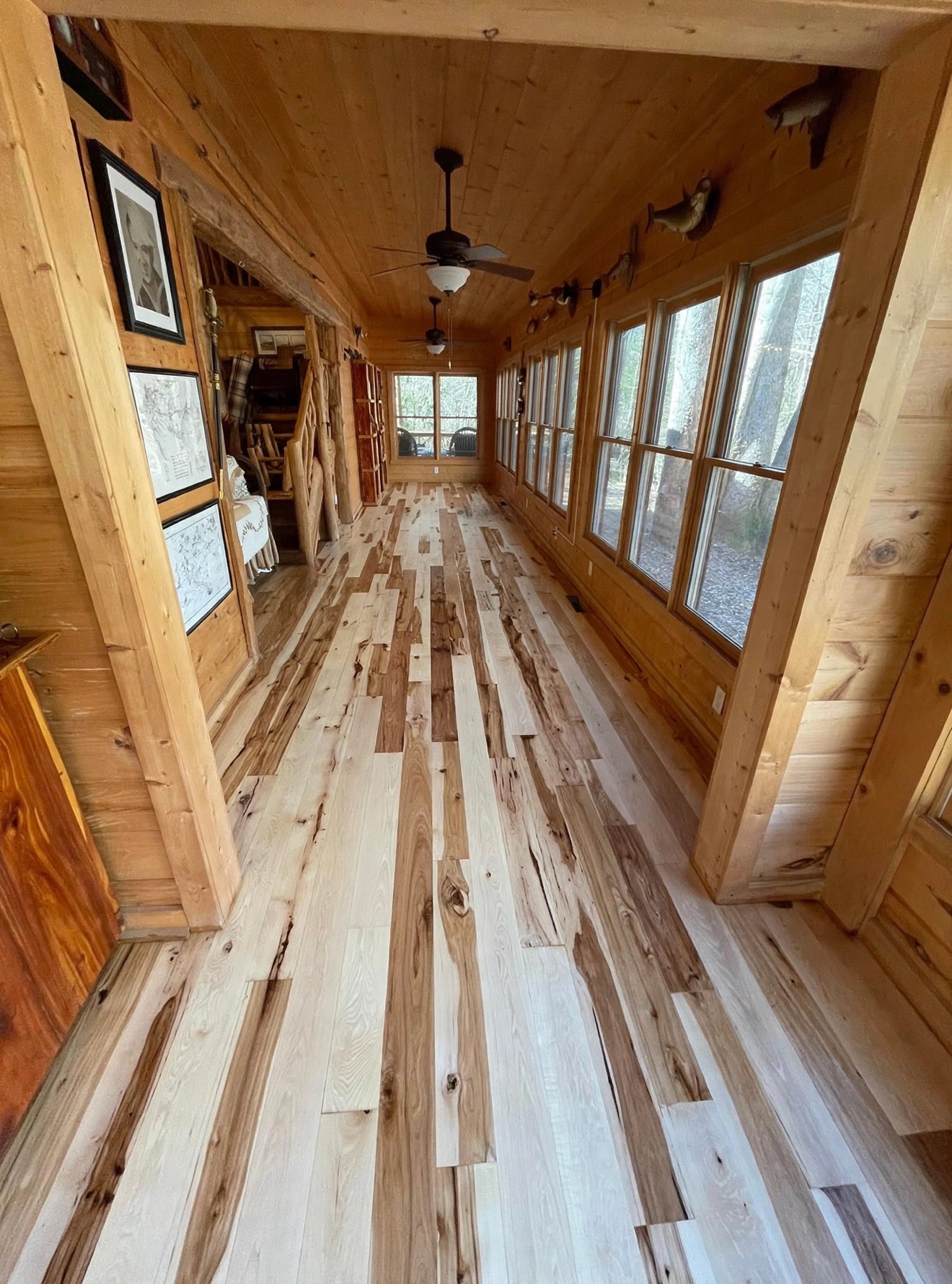 Light hardwood flooring in a cabin hallway