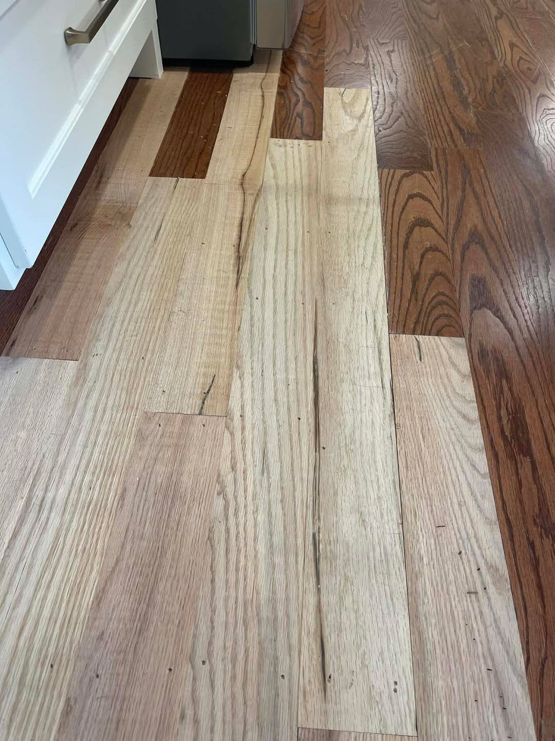 New light boards woven into dark existing floor