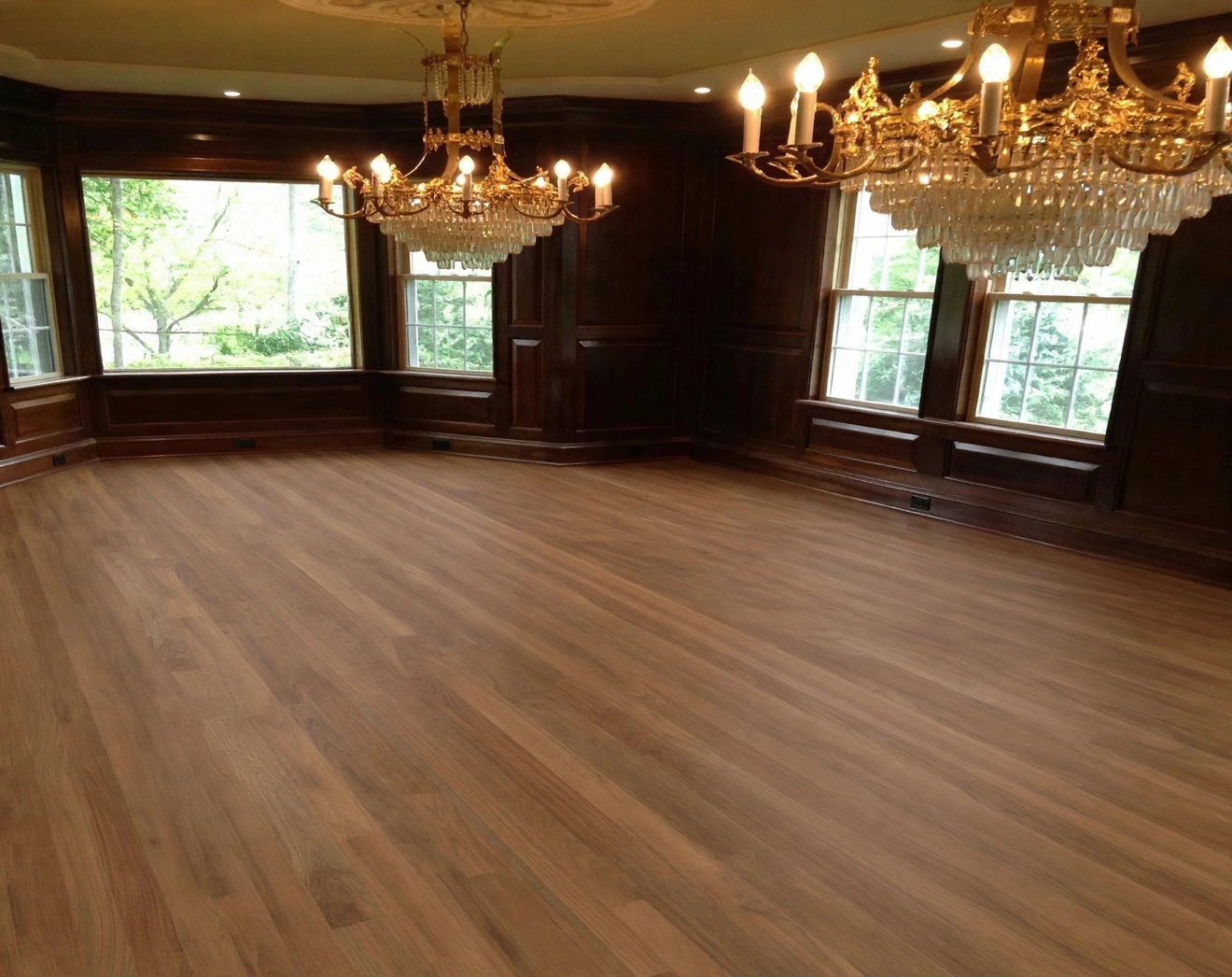 Elegant room with dark paneled walls and light hardwood floor