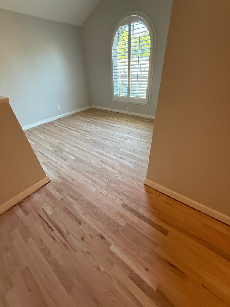 Light sanded hardwood floors in a bright Calhoun GA room