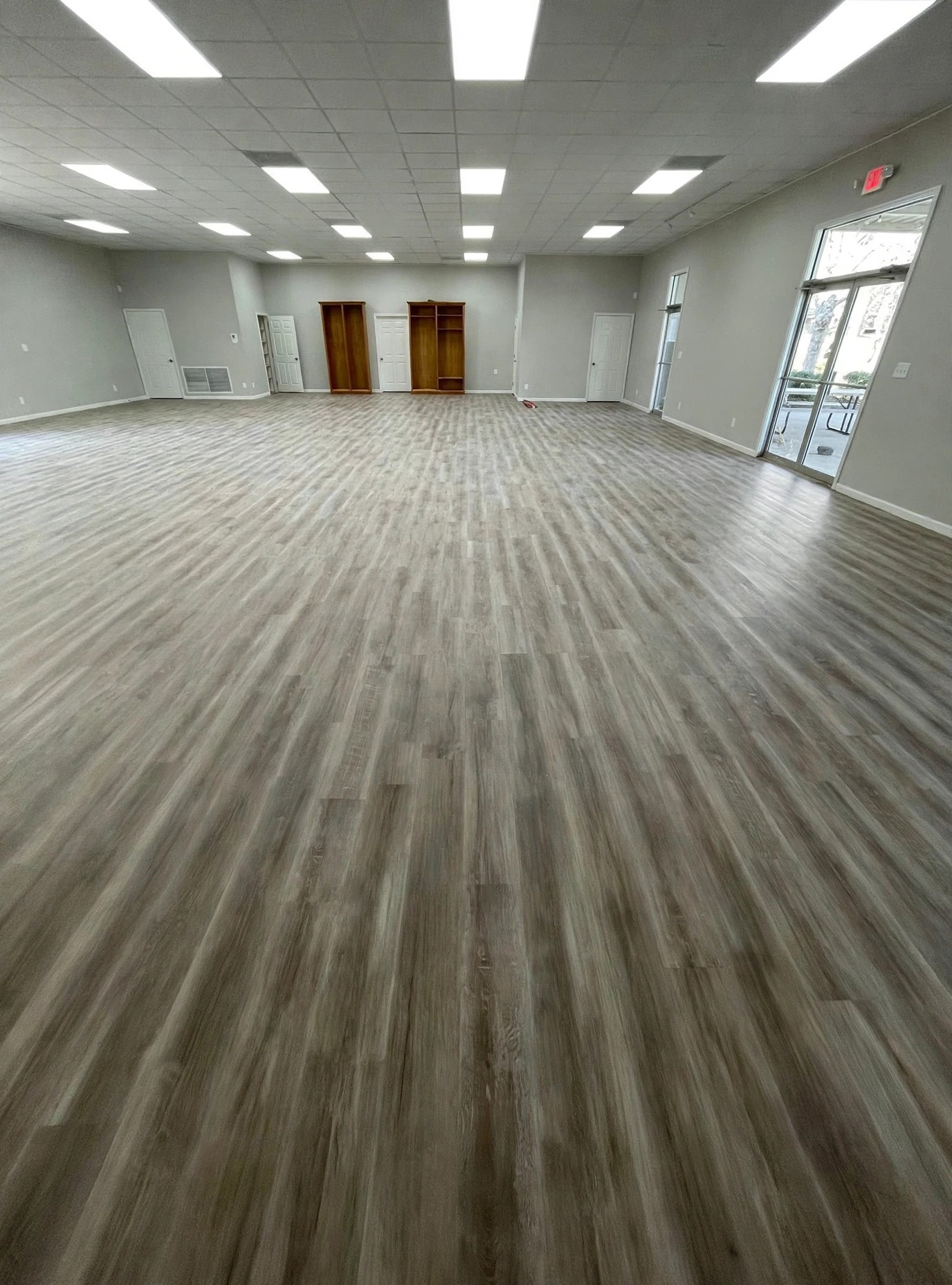 Commercial luxury vinyl plank floor in a large room